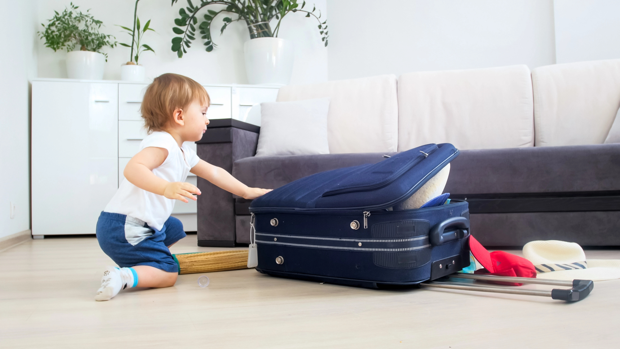 5 Tried and True Thanksgiving Family Travel Tips - Toddler Packing Small Suitcase