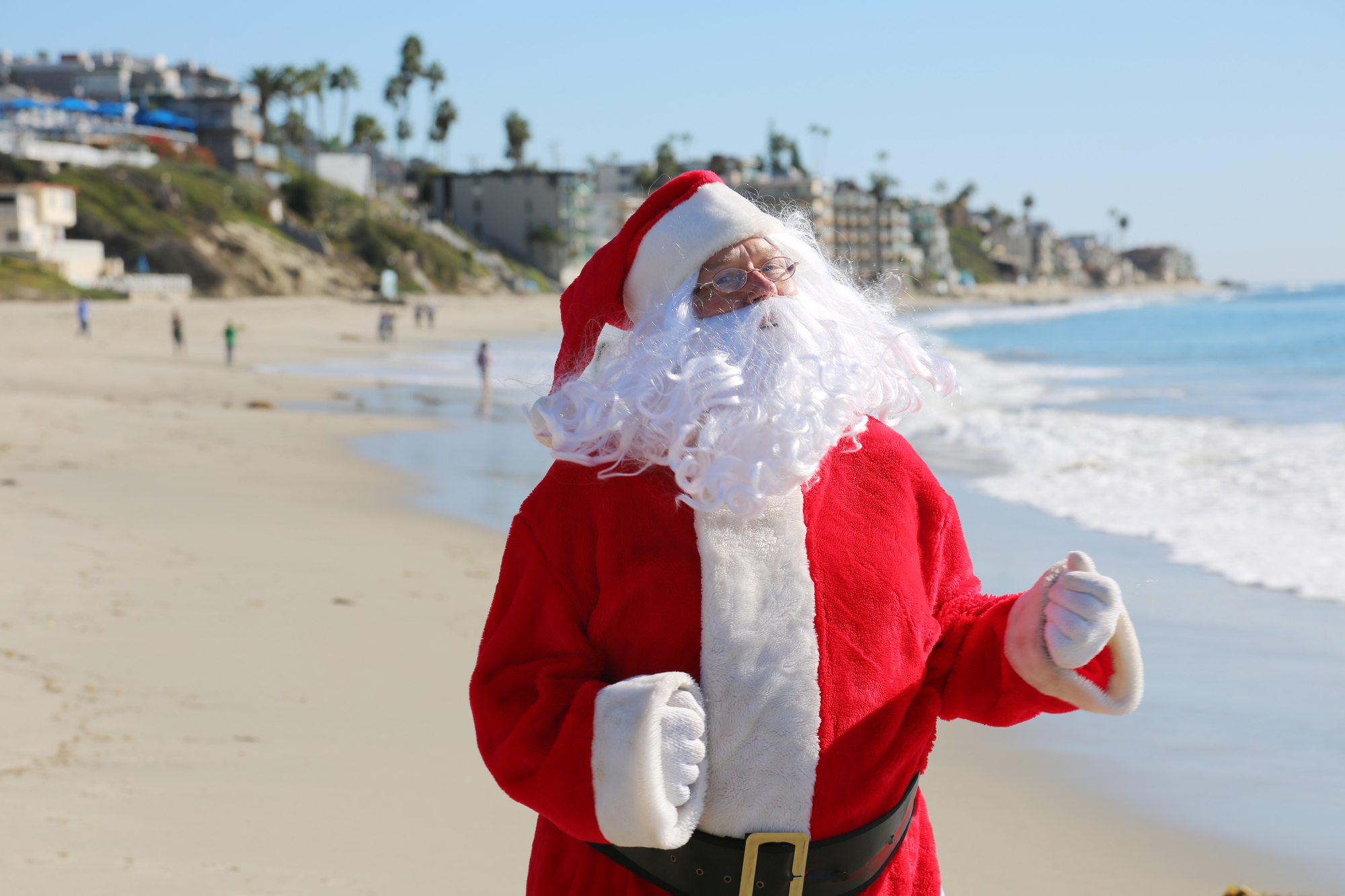 10 Most Christmassy Towns in the USA for a Family Vacation - Santa Claus on the Beach