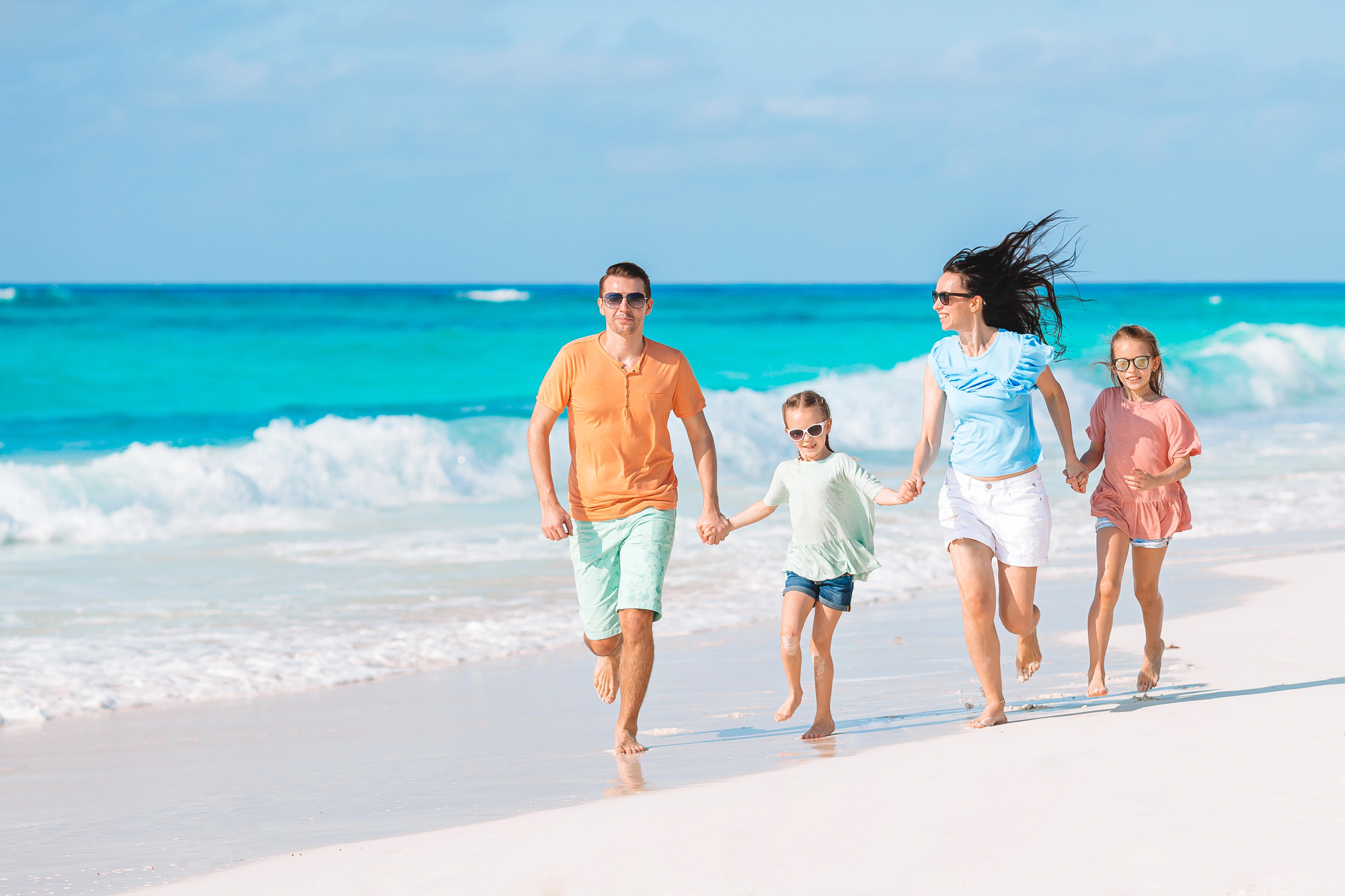 Spring Break Family Vacations Everyone Will Love - Family Having Fun on the Beach