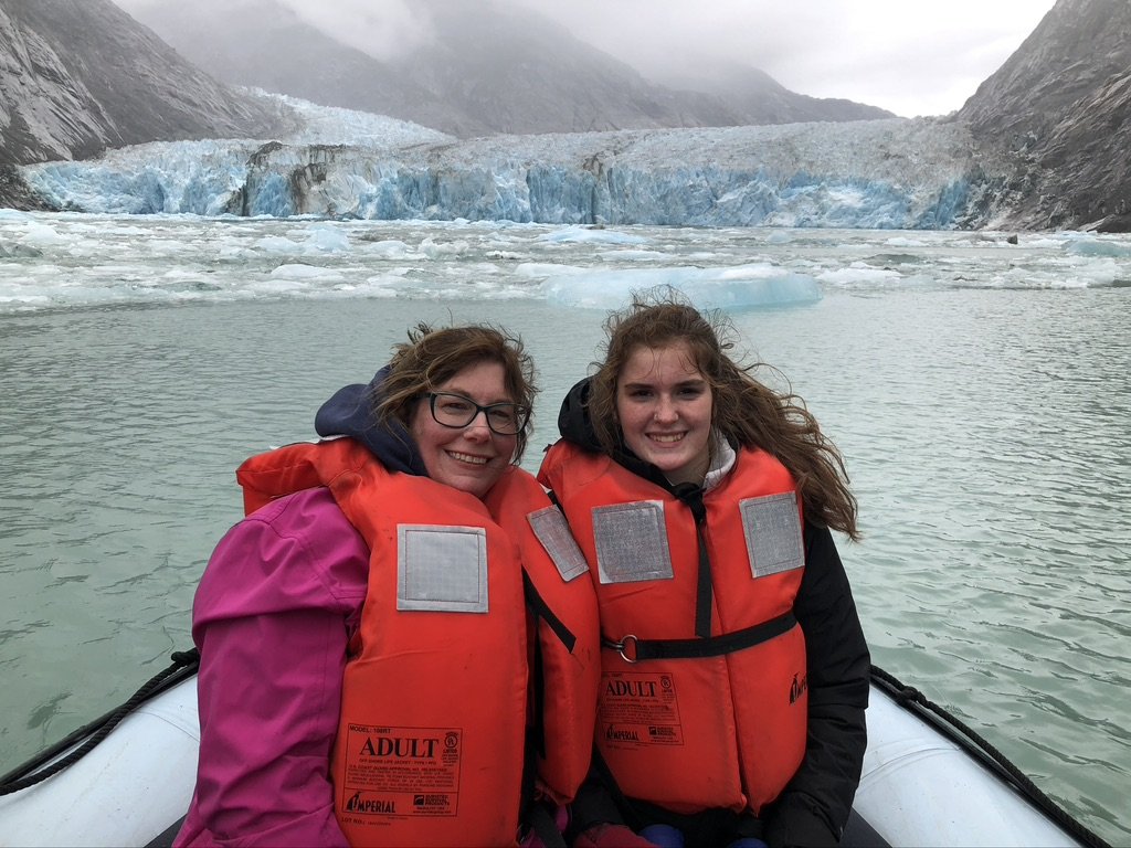 me and my daughter in life jackets on a boat in Alaska