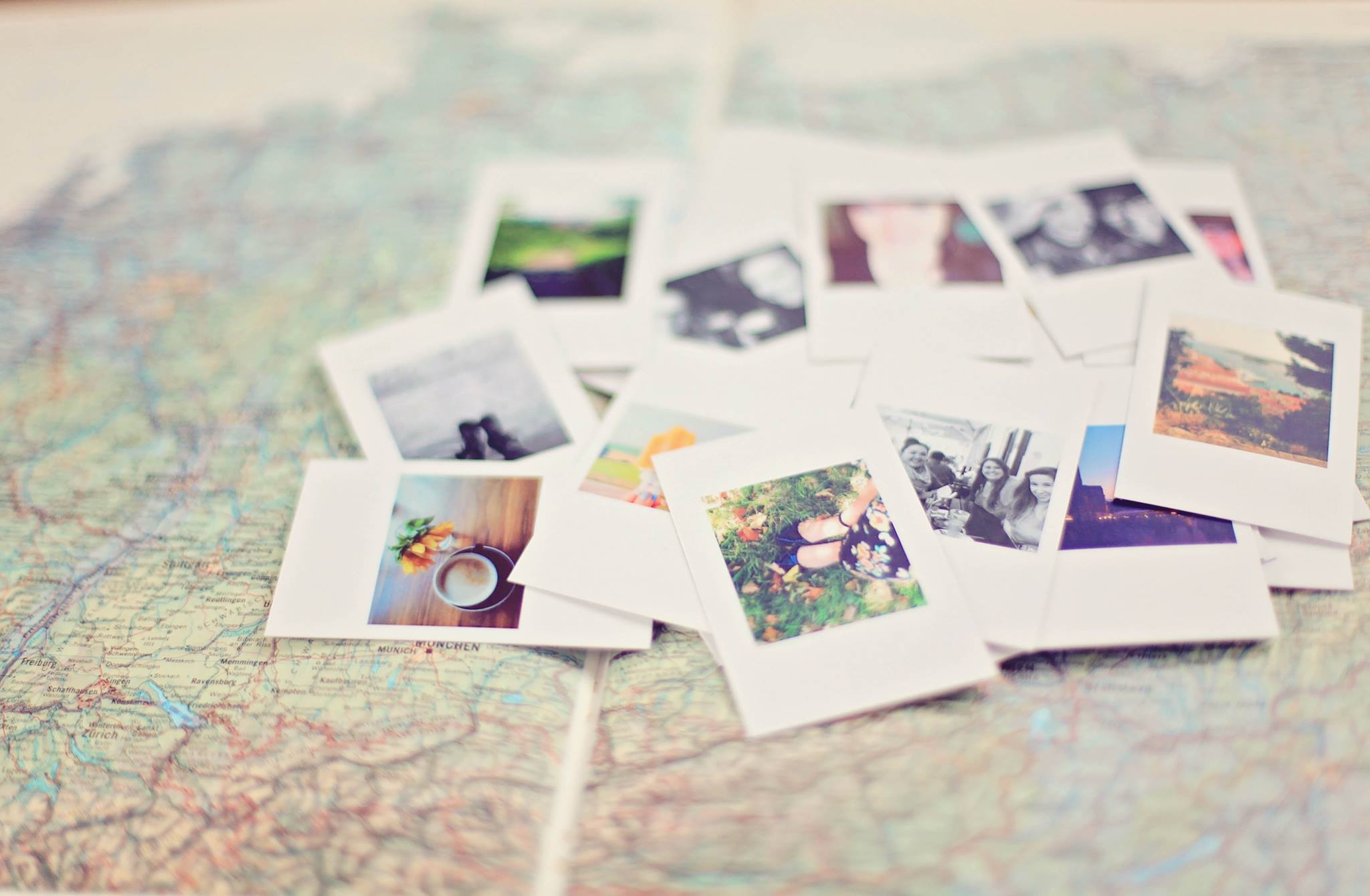 polaroid pictures on a map
