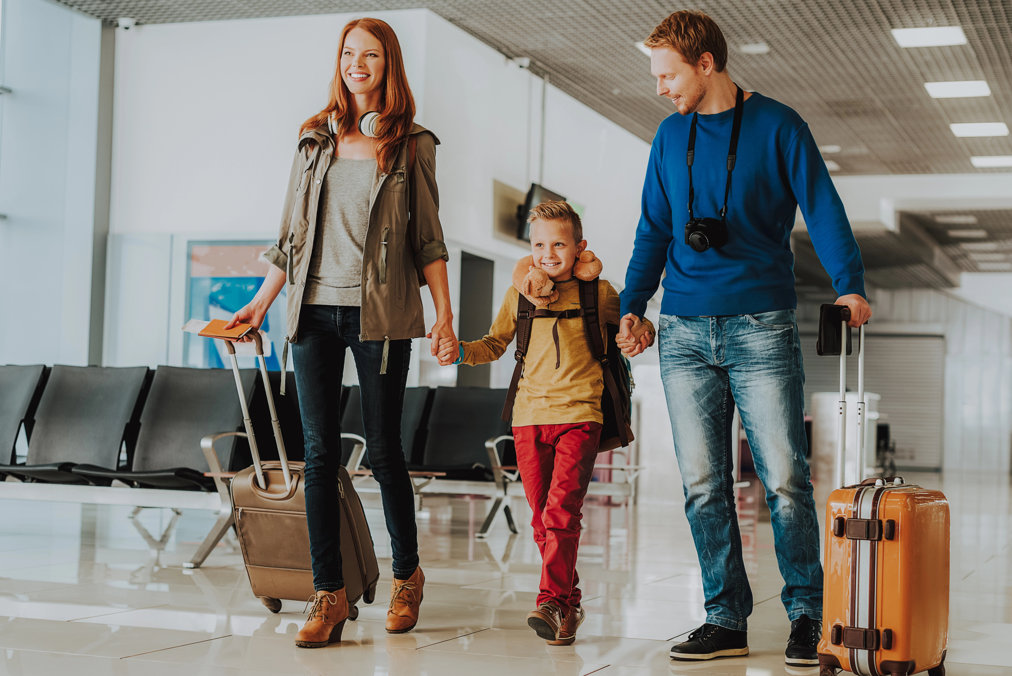 How to Avoid Airport Crowds for Your Family Vacation - Family with Carry-On Luggage