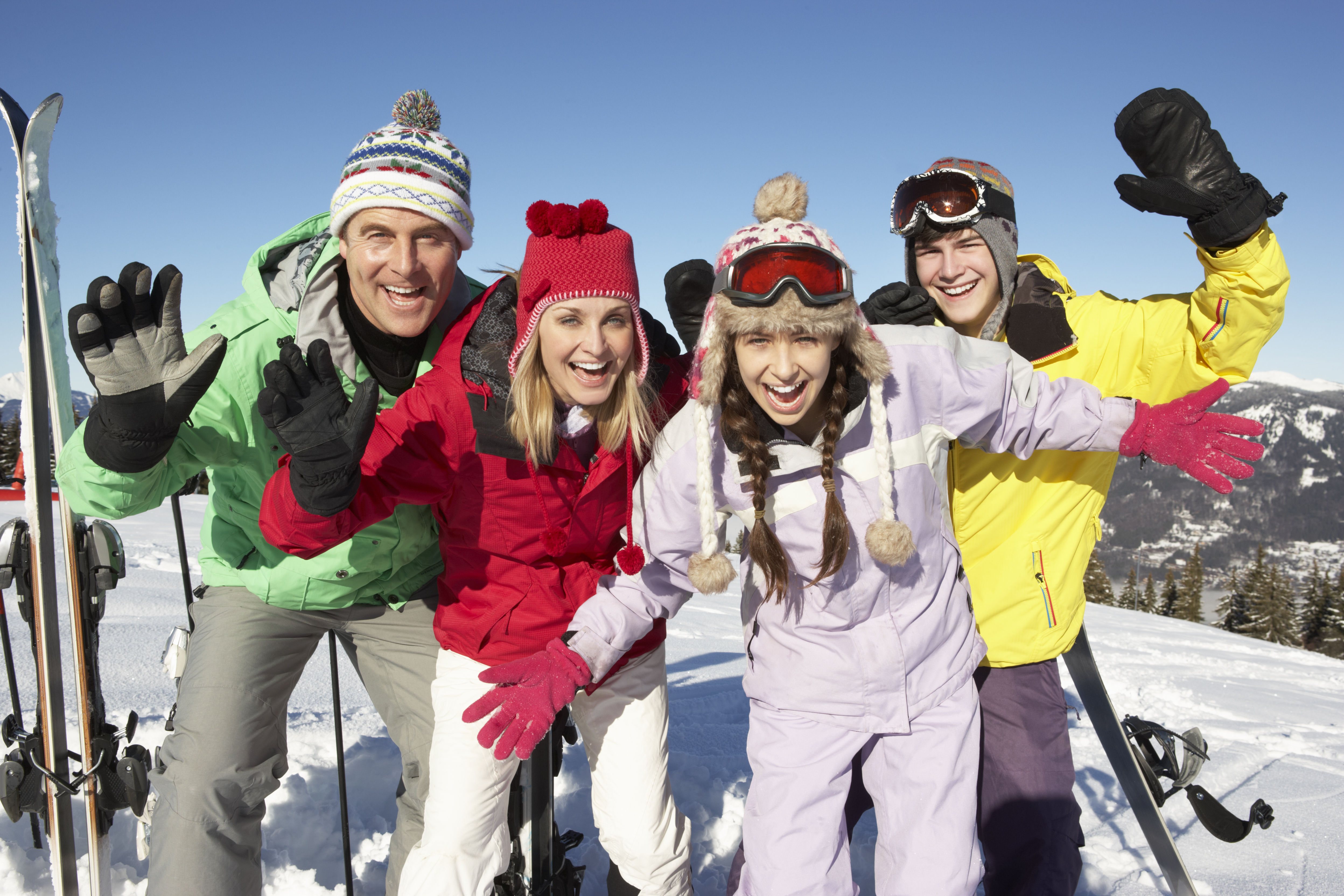 Connecting With Family This Holiday Season - Family Skiing Together