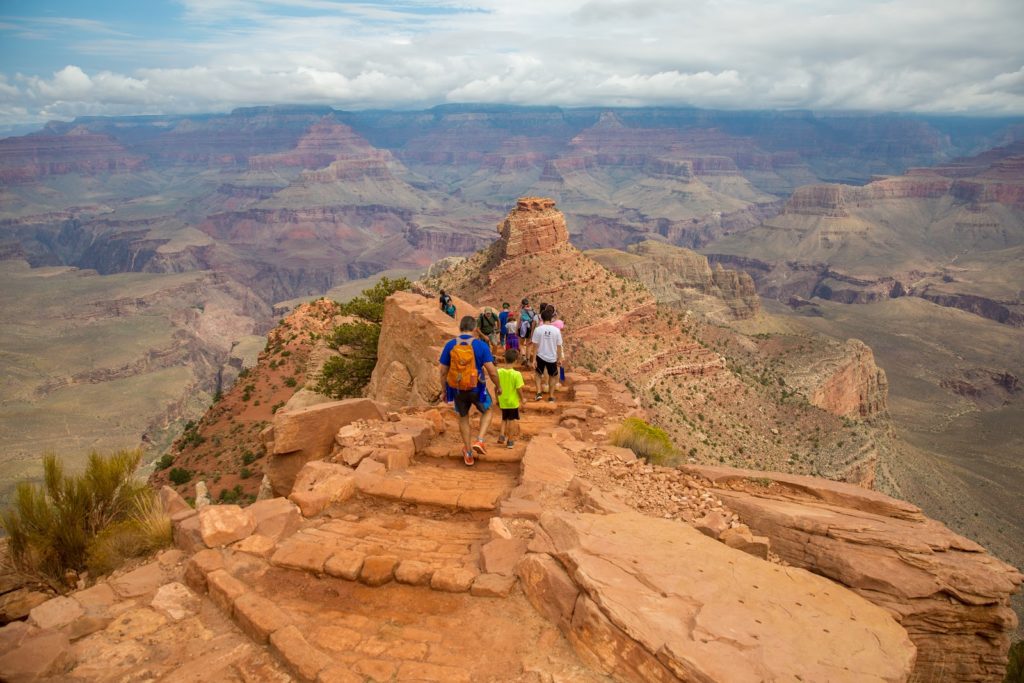 family walking at the Grand Canyon elite travel journeys