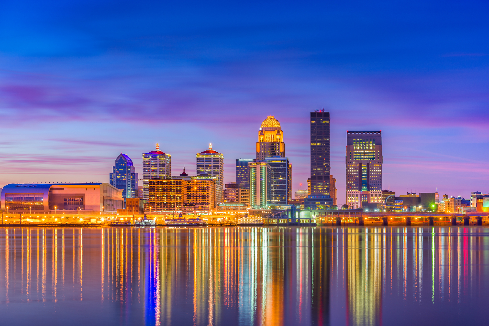 Louisville, Kentucky, USA downtown skyline at the river at dusk.
