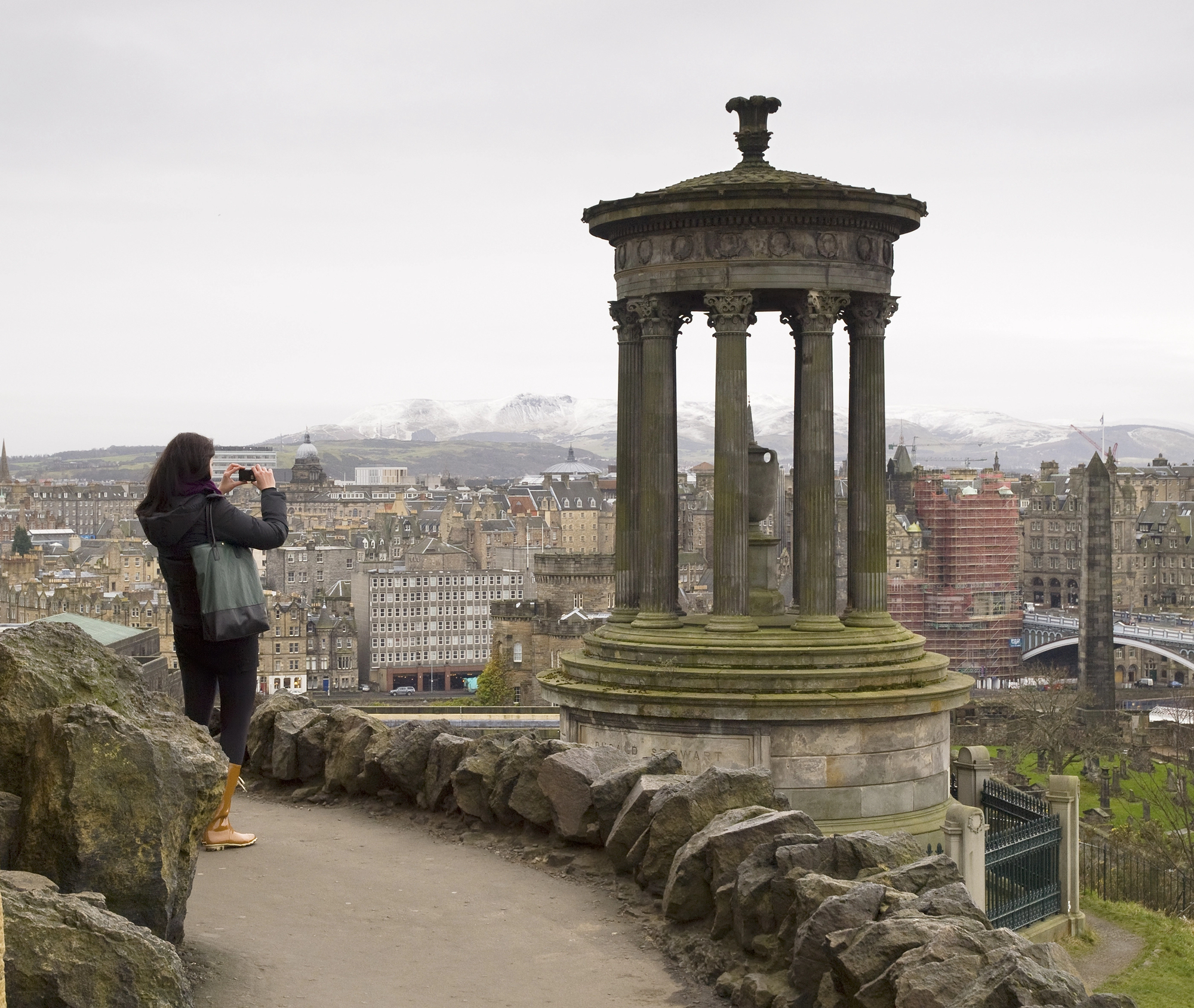 Best Historical Destinations for Solo Women Travelers - Solo Female Traveler Looking Out Over Edinburgh, Scotland from Calton Hill