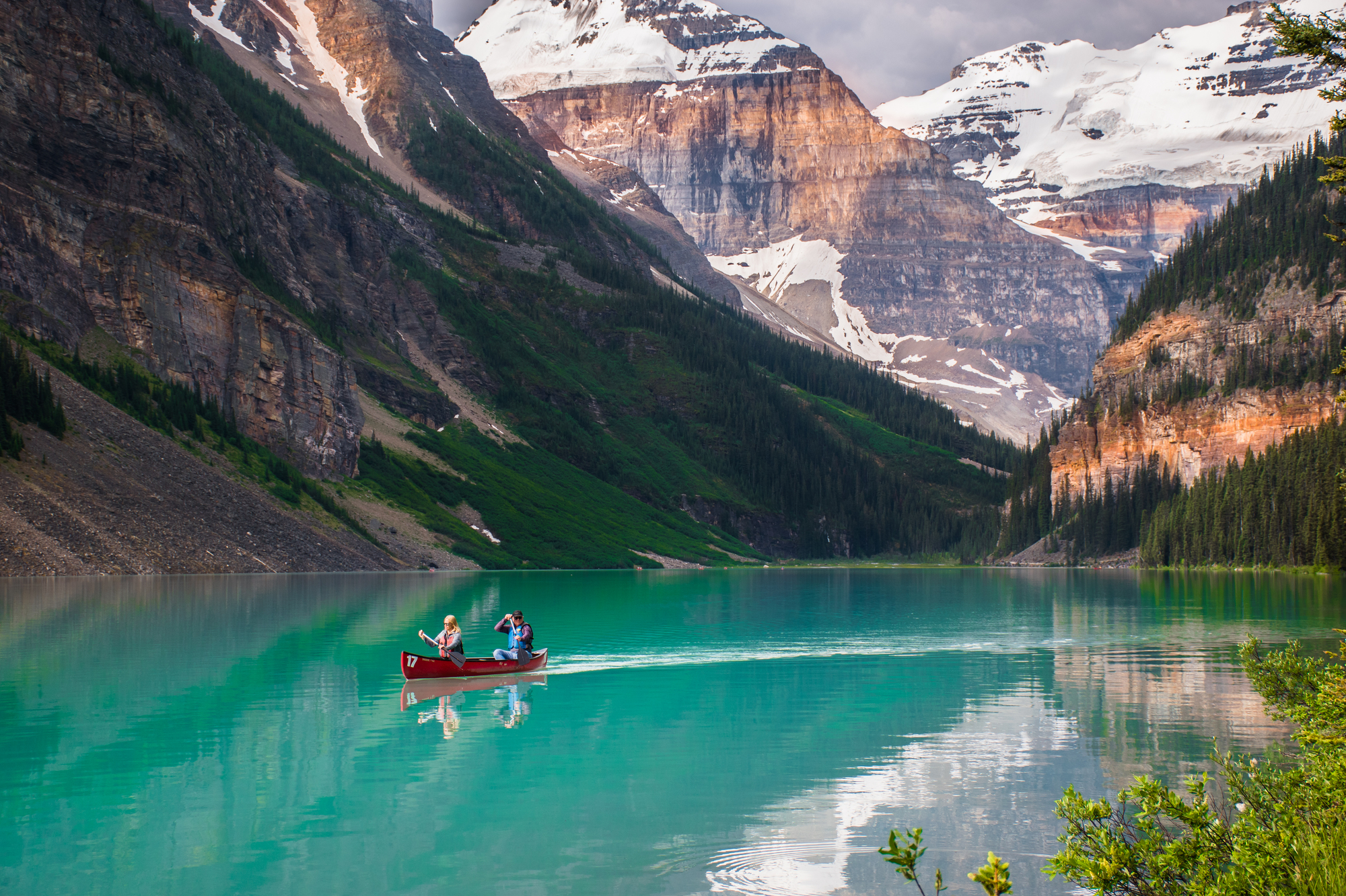 Best Destinations for Empty Nesters: Rediscover the Joy of Adventure Together - Couple Canoeing on Lake Louise in Banff National Park