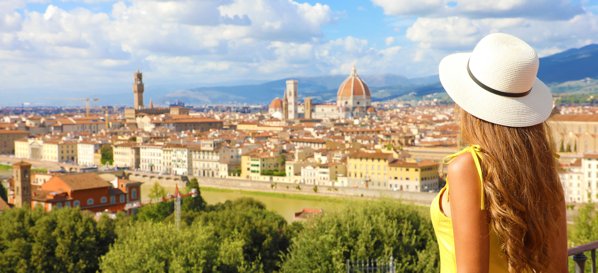 Best Destinations for Solo Female Travelers in Europe - Solo Female Traveler Looking Out Towards the City of Florence in Italy