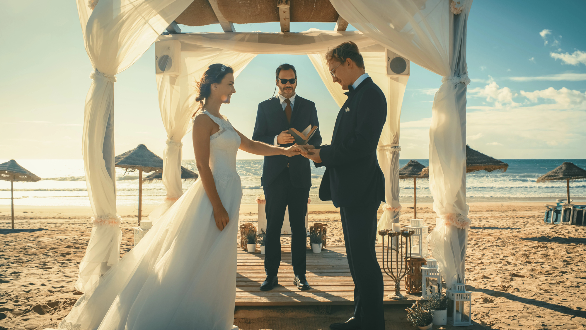 Why Hire a Travel Advisor for Your Destination Wedding? - Couple at the Altar on the Beach for Their Destination Wedding