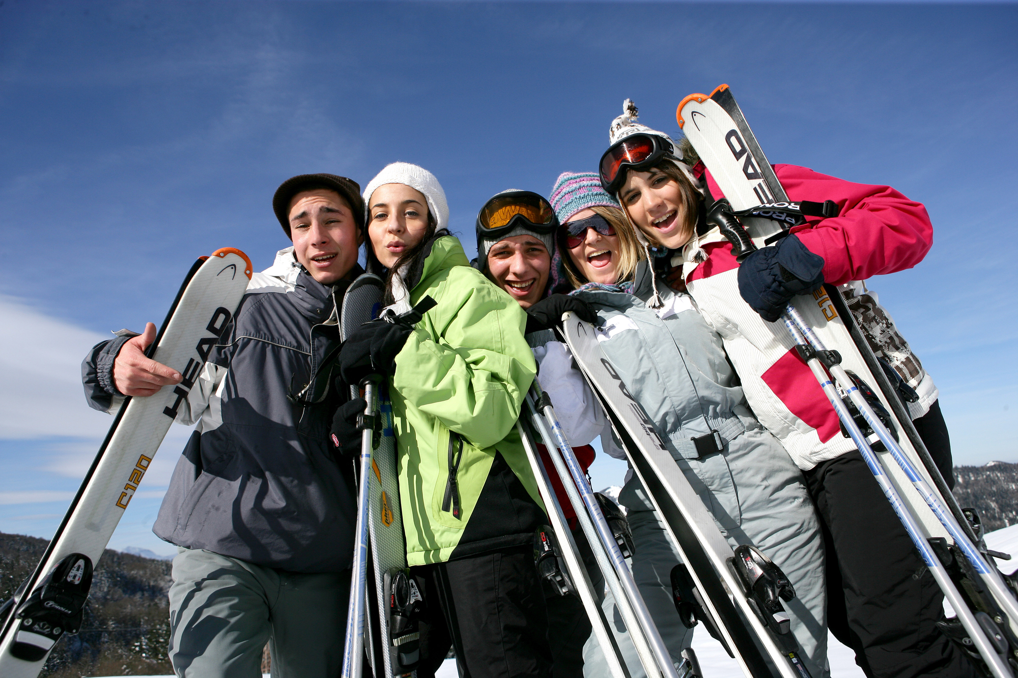 Summer vs Winter Travel Destinations: Where to Go and When to Go - Family Skiing at a Winter Travel Destination