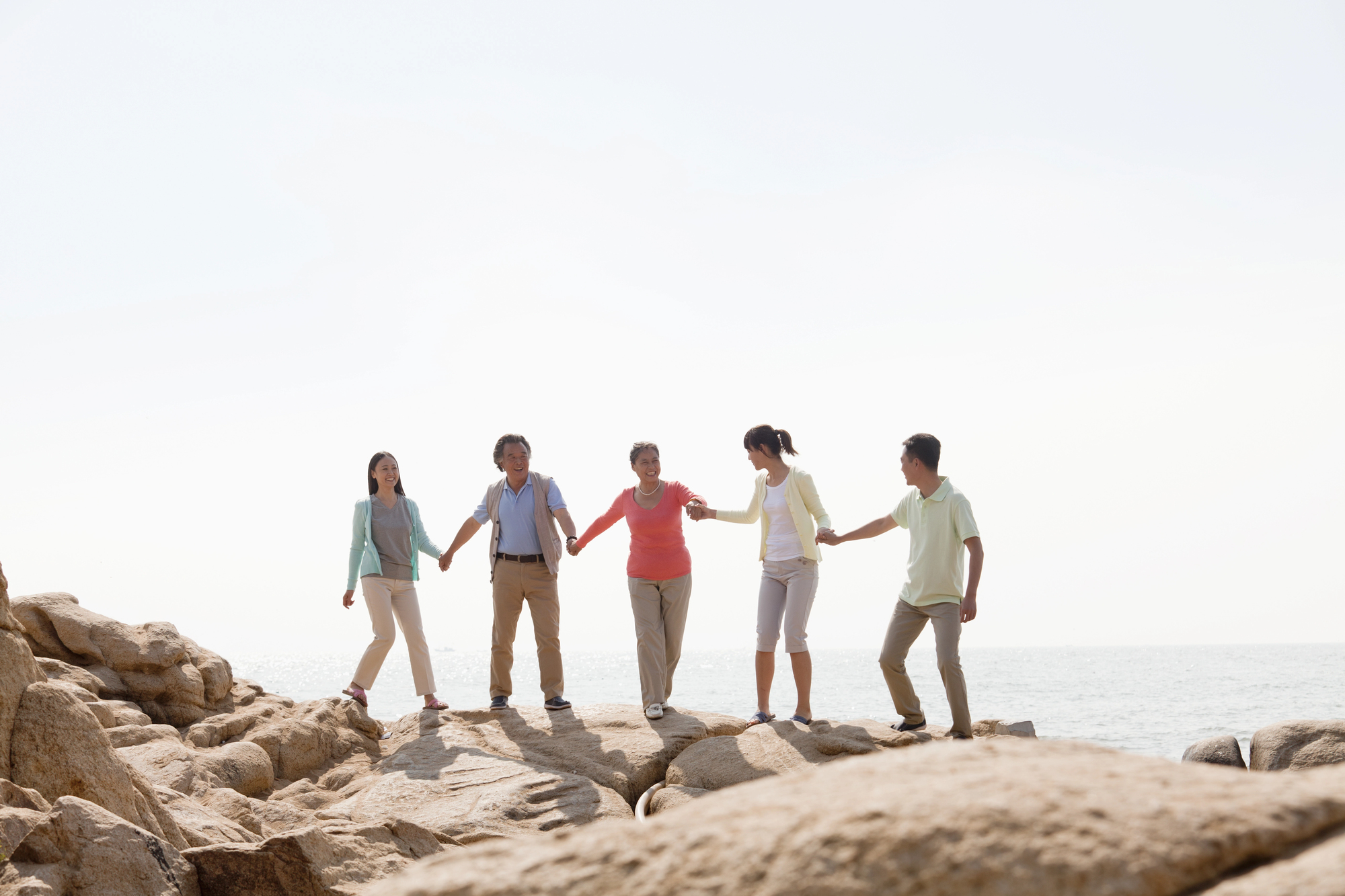How to Plan a Multigenerational Family Vacation Without Stress - Multigenerational Family at the Beach
