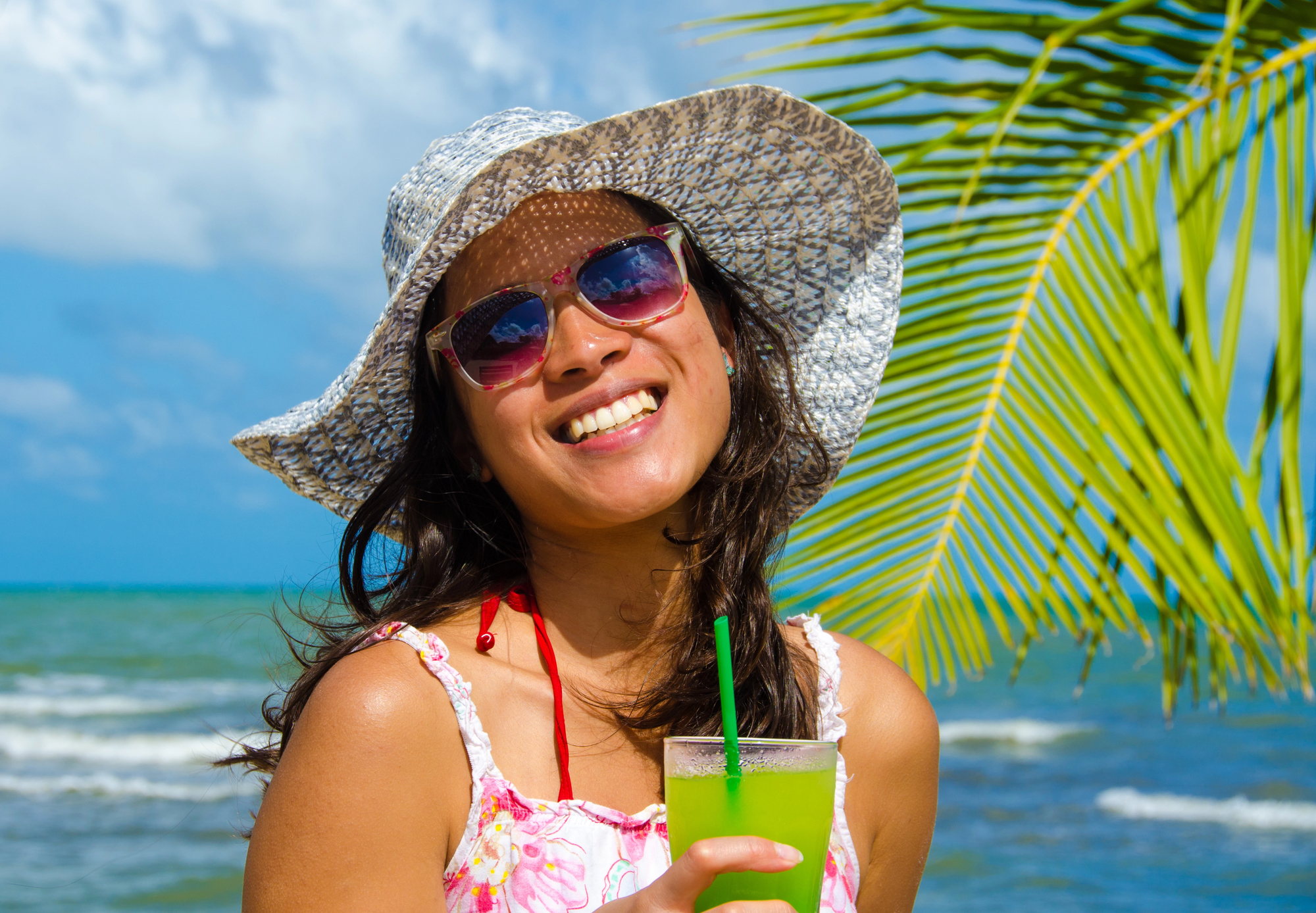 Belize Travel Guide for Families: Multigenerational Adventures, Relaxation, and Must-See Attractions - Woman with Cocktail on the Beach in Belize
