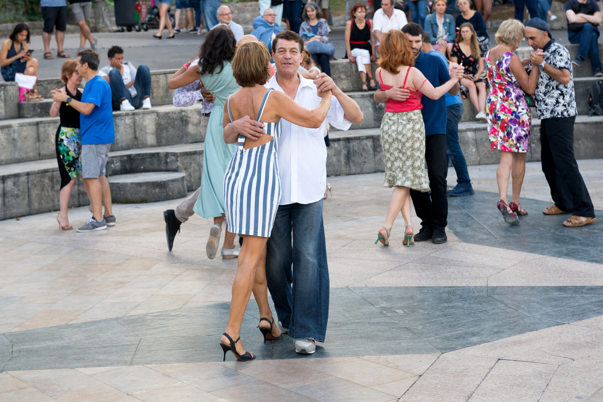Cultural Immersion Travel for Empty Nesters: Authentic Experiences Around the World - Couple Dancing on the River Seine 
