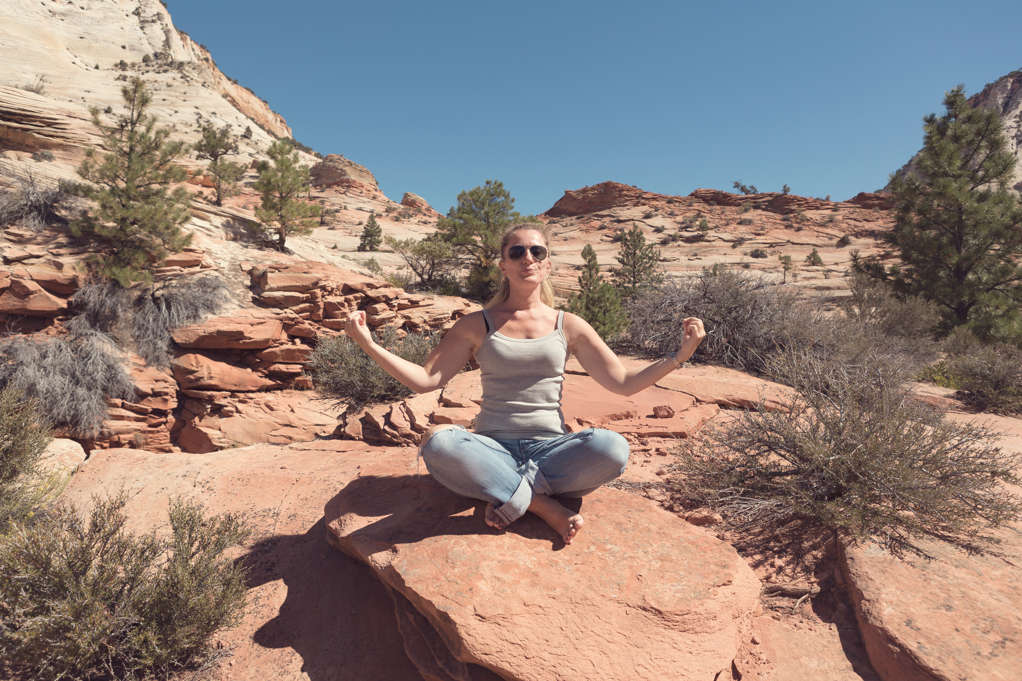 Best National Parks for Solo Female Travelers: Safe, Inspiring, Unforgettable - Solo Female Traveler Meditating on a Mountain
