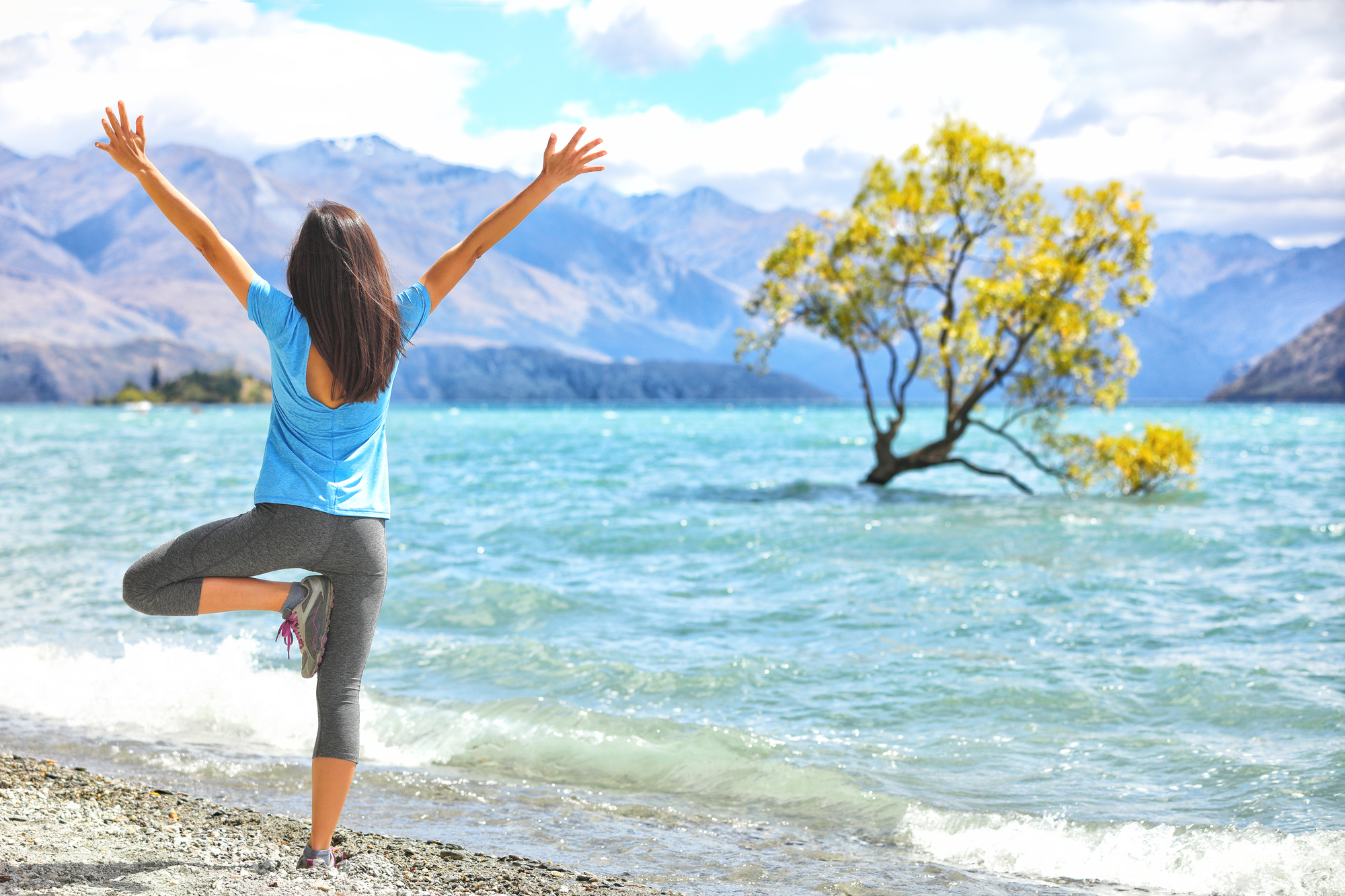 Solo Female Travel for Self-Care: How a Journey Alone Can Heal, Empower & Renew - Solo Female Traveler Doing Yoga in New Zealand