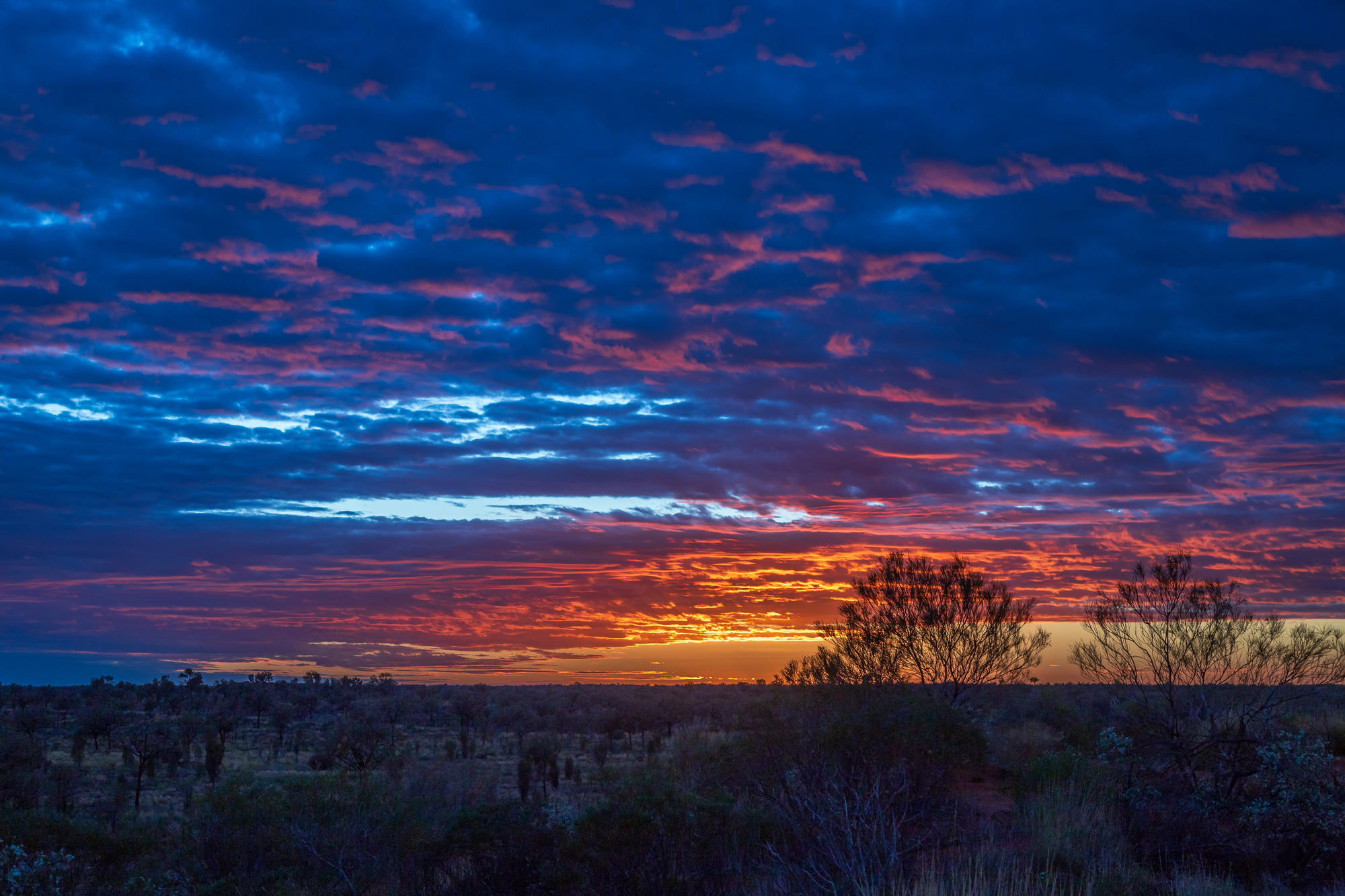 The Australian Outback Is Calling — And Solo Female Travelers Are Answering in Style - Sunset Near Ayers Rock in Uluru in Australia Outback