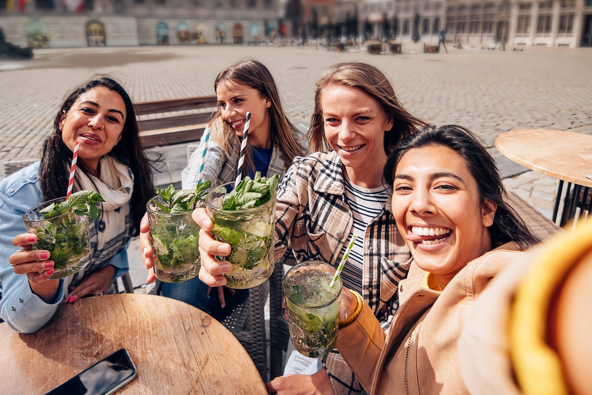 The Truth About Group Travel Planning (And Why It Falls Apart Without a Travel Advisor) - Group of Women Dining Together in a City Center