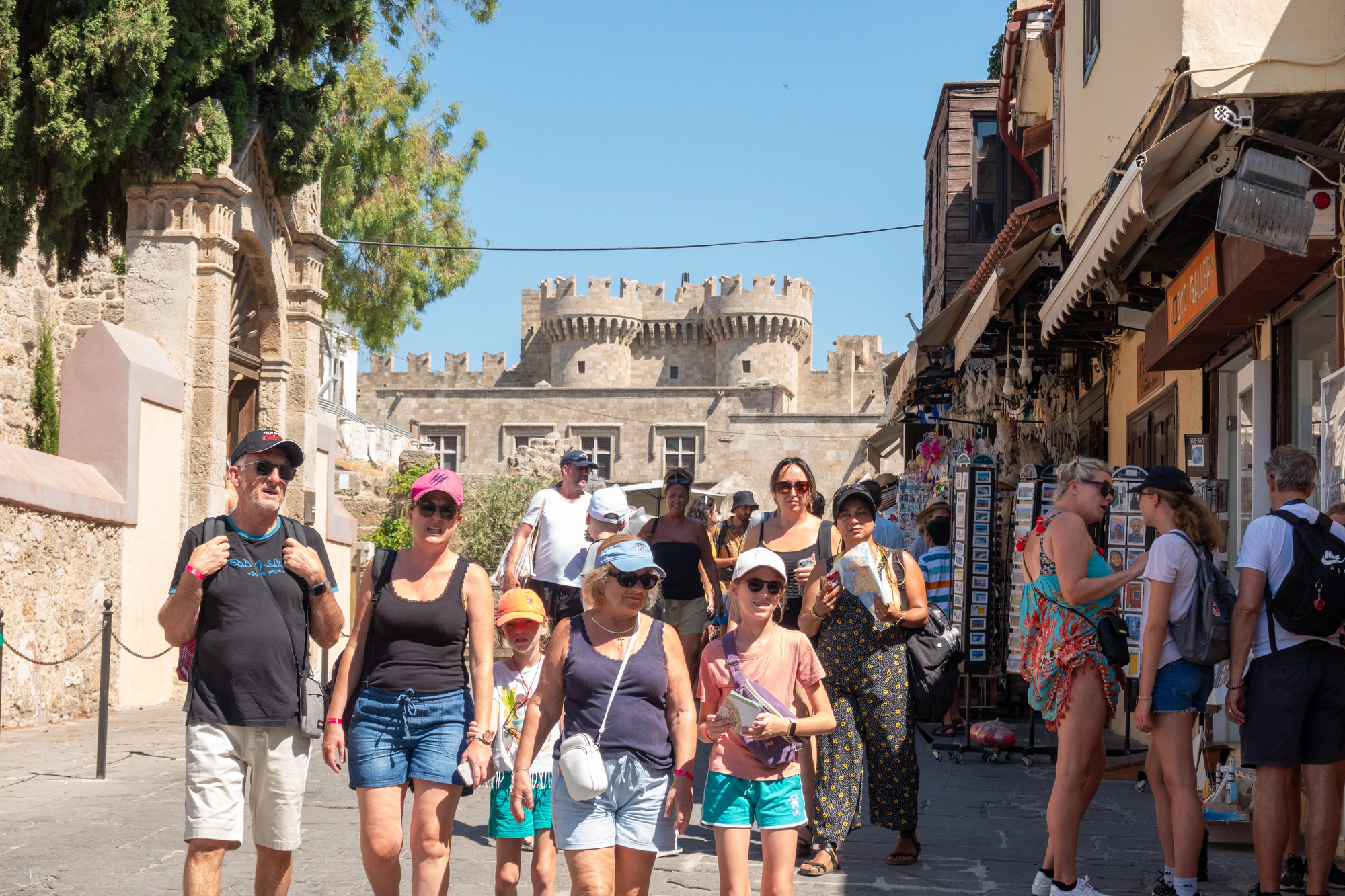 Family Walking Along Old Town Street in Rhodes