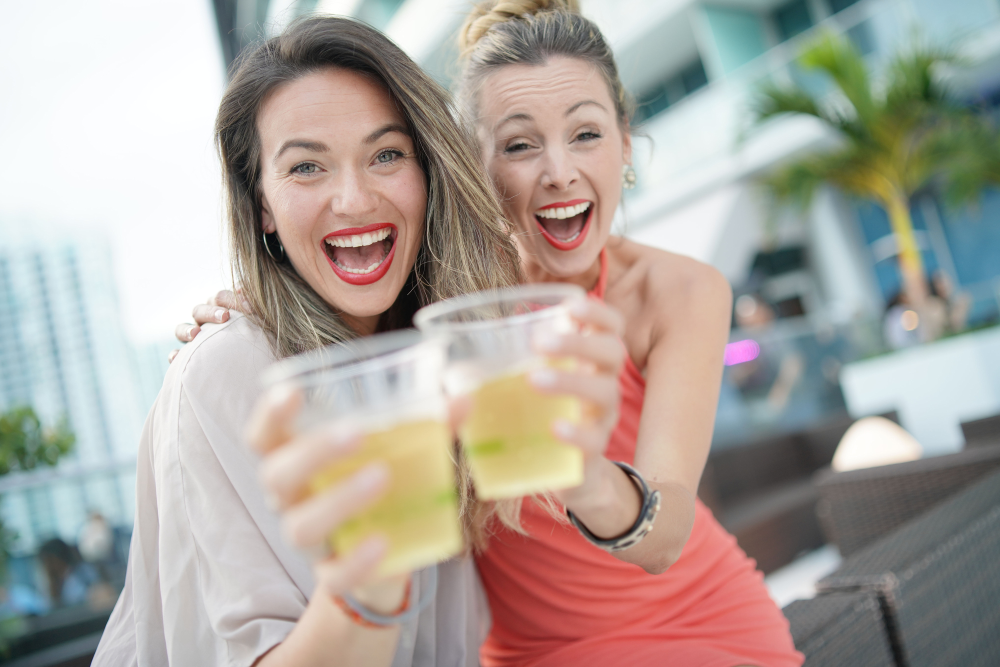 The Art of Balancing Free Time and Planned Activities on Group Trips - Females with Drinks on a Rooftop Bar
